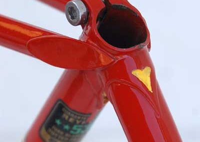 A close up of a red bicycle frame.