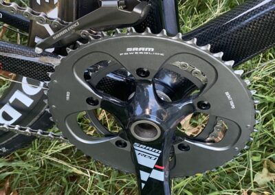 A close up of a bicycle with a chain and chainring.