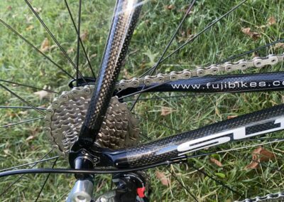 A close up of a bicycle with a chain on it.